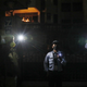 Those on duty and with no access to candles improvised with flashlights on their mobile phones, like these security guards in New Delhi.